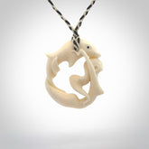 This pendant is a gorgeous and intricately carved mermaid with dolphin pendant. Carved by renowned bone carver Yuri Terenyi for us. This is a little masterpiece. It is a mermaid with her arms clasped around a dolphin. The craftsmanship displayed in this piece is extraordinary - a collectors item, or a piece to wear and love.